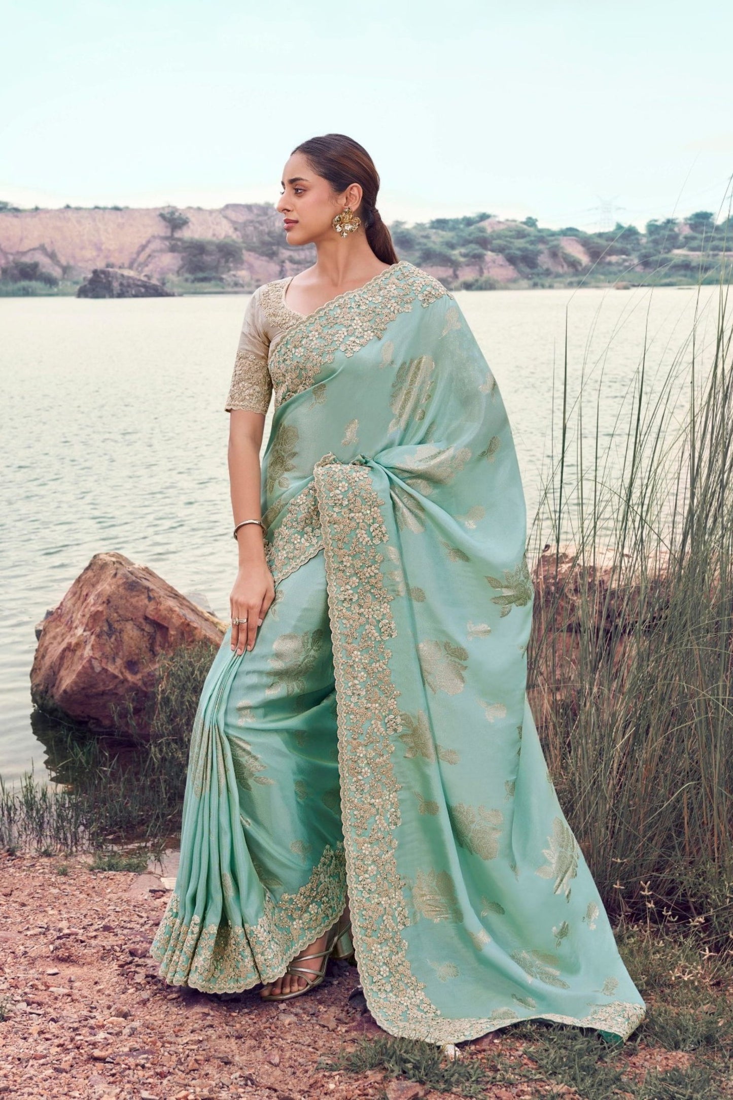 Pastel Mint Green Designer Silk Saree with Heavy Golden Blouse