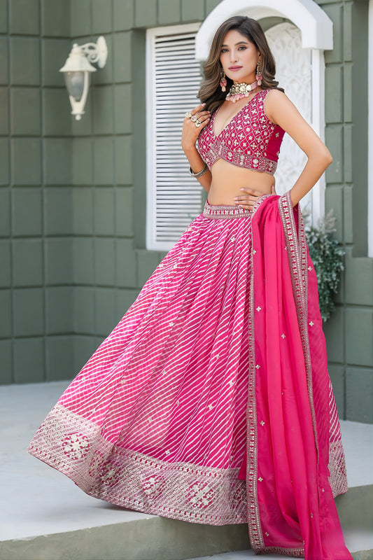 Vibrant Pink Art Silk Lehenga Choli with Heavy Embroidered Border and Matching Dupatta