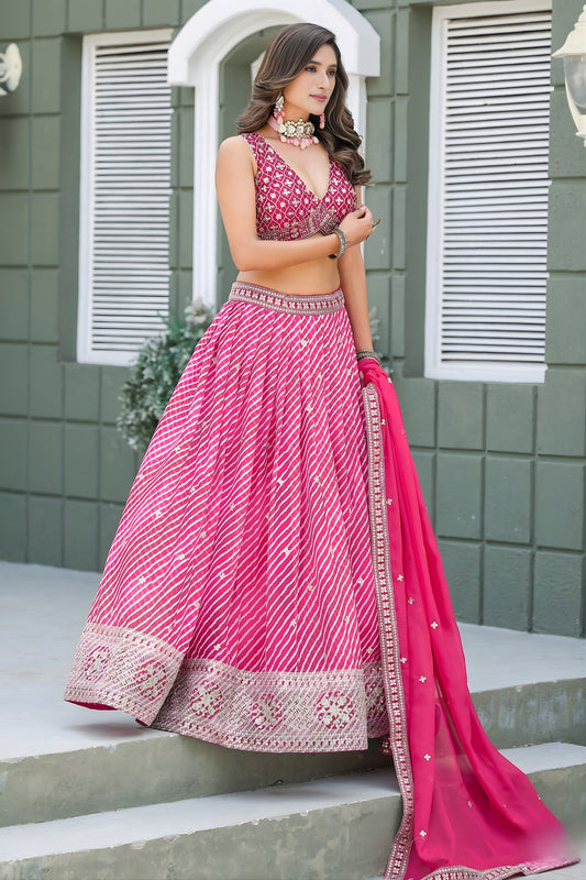 Vibrant Pink Art Silk Lehenga Choli with Heavy Embroidered Border and Matching Dupatta