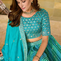 Glorious Sea Green Art Silk Lehenga Choli with Heavy Embroidered Border and Matching Dupatta