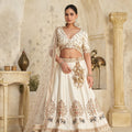 Elegant Cream Silk Embroidered Lehenga Choli with Elephant Motif and Dupatta for Wedding