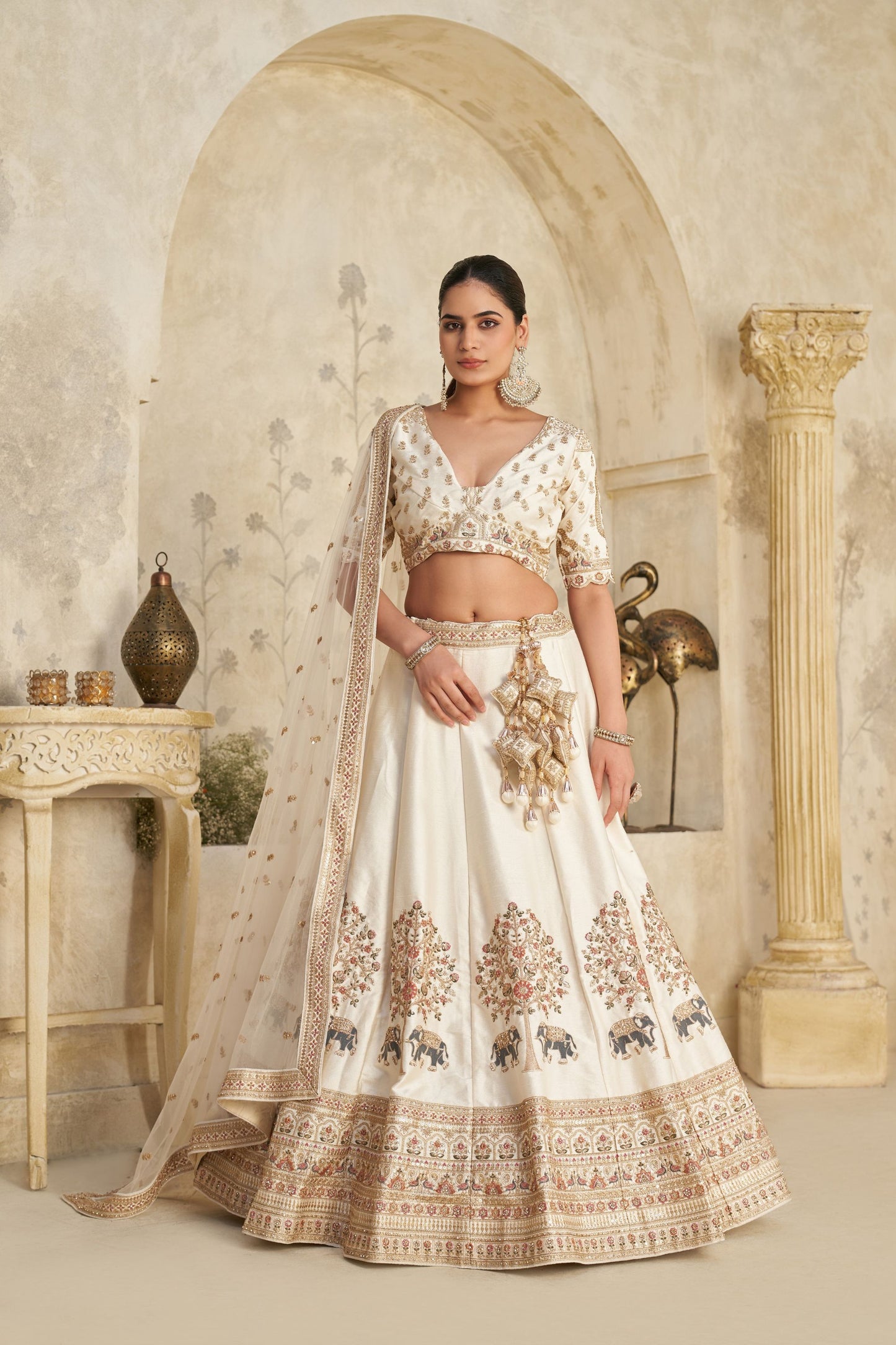 Elegant Cream Silk Embroidered Lehenga Choli with Elephant Motif and Dupatta for Wedding