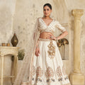 Elegant Cream Silk Embroidered Lehenga Choli with Elephant Motif and Dupatta for Wedding
