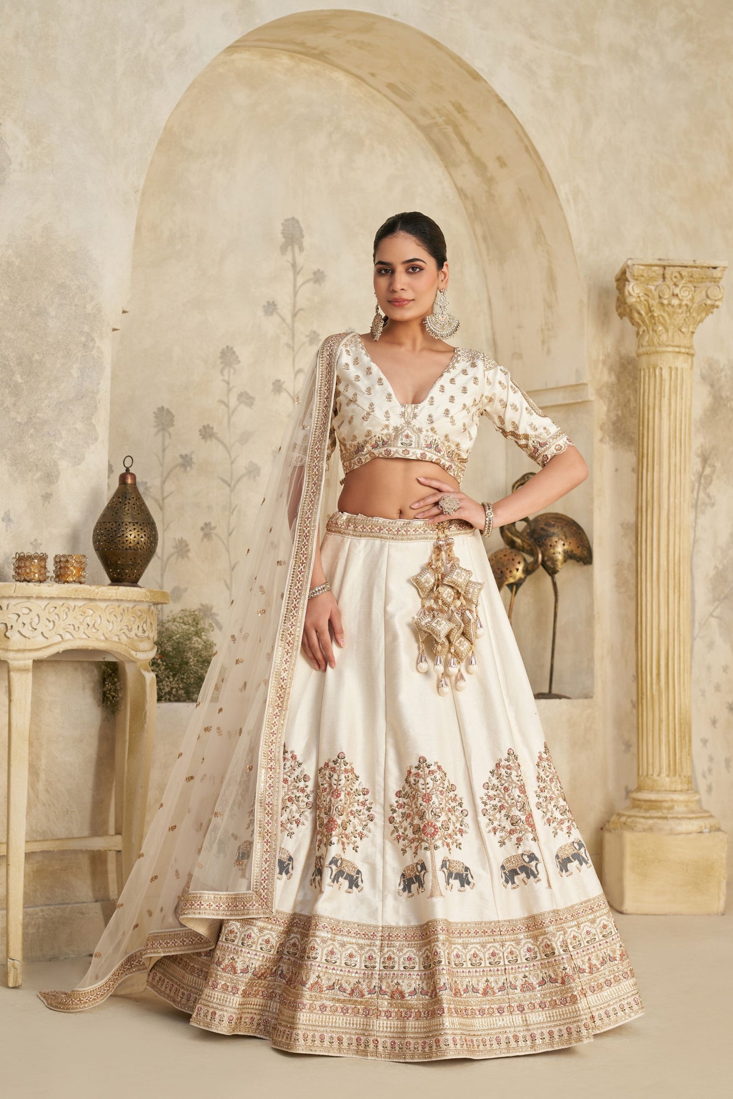Elegant Cream Silk Embroidered Lehenga Choli with Elephant Motif and Dupatta for Wedding