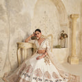 Elegant Cream Silk Embroidered Lehenga Choli with Elephant Motif and Dupatta for Wedding