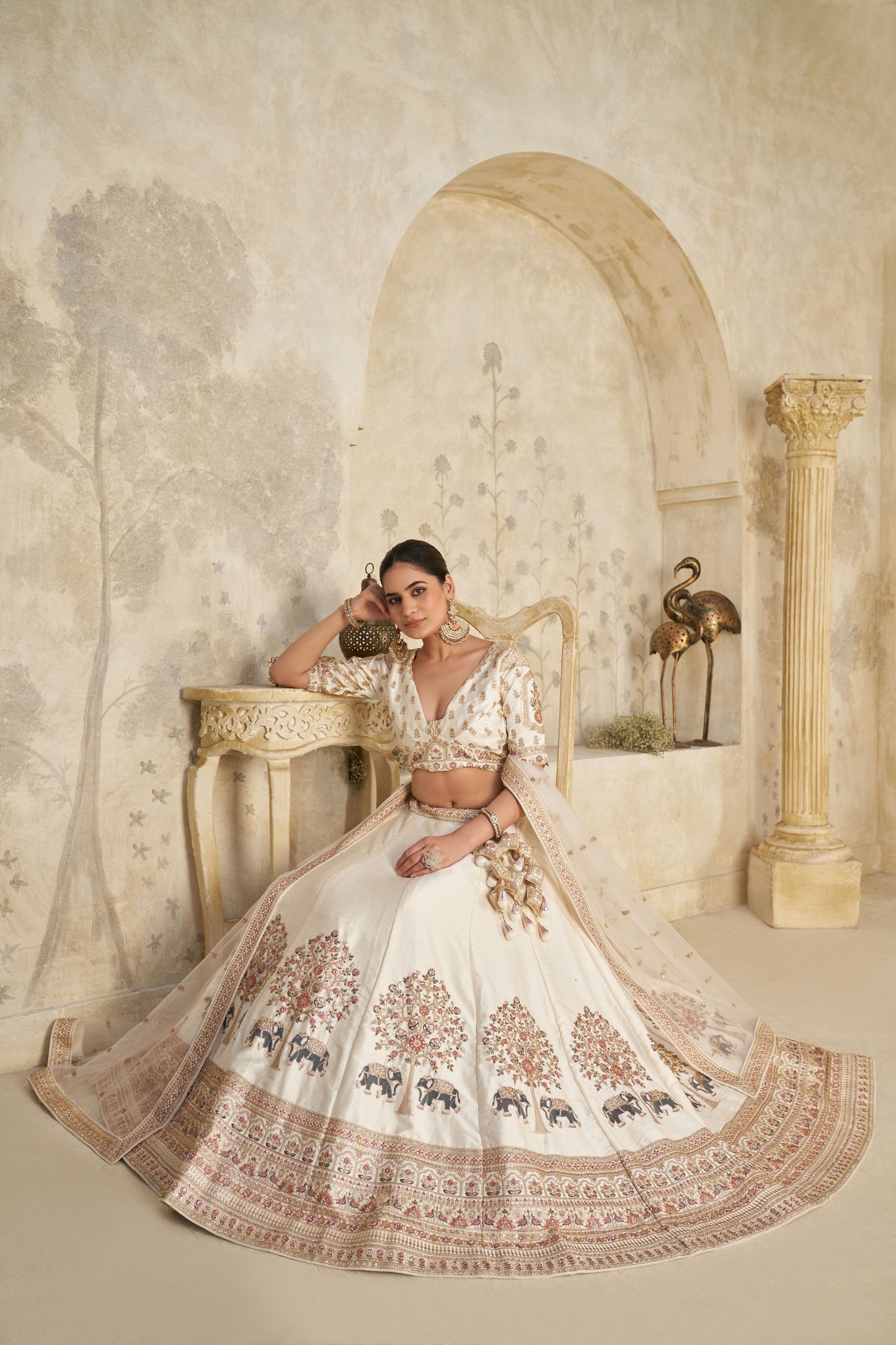 Elegant Cream Silk Embroidered Lehenga Choli with Elephant Motif and Dupatta for Wedding