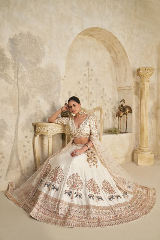 Elegant Cream Silk Embroidered Lehenga Choli with Elephant Motif and Dupatta for Wedding