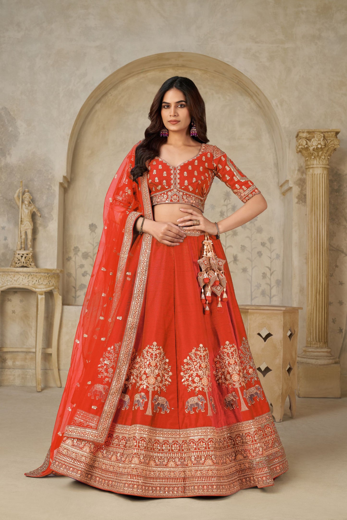 Radiant Rust Orange Silk Embroidered Lehenga Choli with Elephant Motif and Dupatta for Wedding
