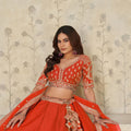Radiant Rust Orange Silk Embroidered Lehenga Choli with Elephant Motif and Dupatta for Wedding