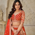 Radiant Rust Orange Silk Embroidered Lehenga Choli with Elephant Motif and Dupatta for Wedding