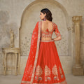 Radiant Rust Orange Silk Embroidered Lehenga Choli with Elephant Motif and Dupatta for Wedding