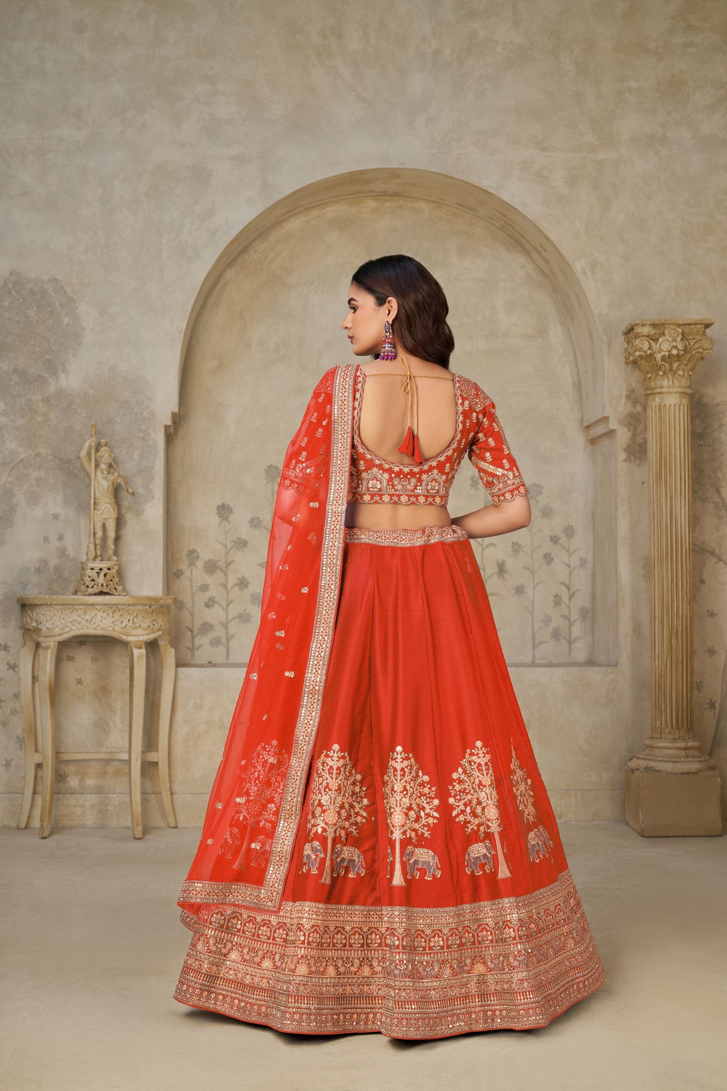 Radiant Rust Orange Silk Embroidered Lehenga Choli with Elephant Motif and Dupatta for Wedding