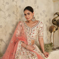 Charming Cream Silk Embroidered Lehenga Choli with Traditional Motifs and Dupatta for Wedding