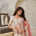 Graceful Cream Silk Embroidered Lehenga Choli with Palace Motifs and Dupatta for Wedding