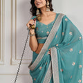 Teal Blue Georgette Saree with Embroidered Border Floral Motifs Party Wear