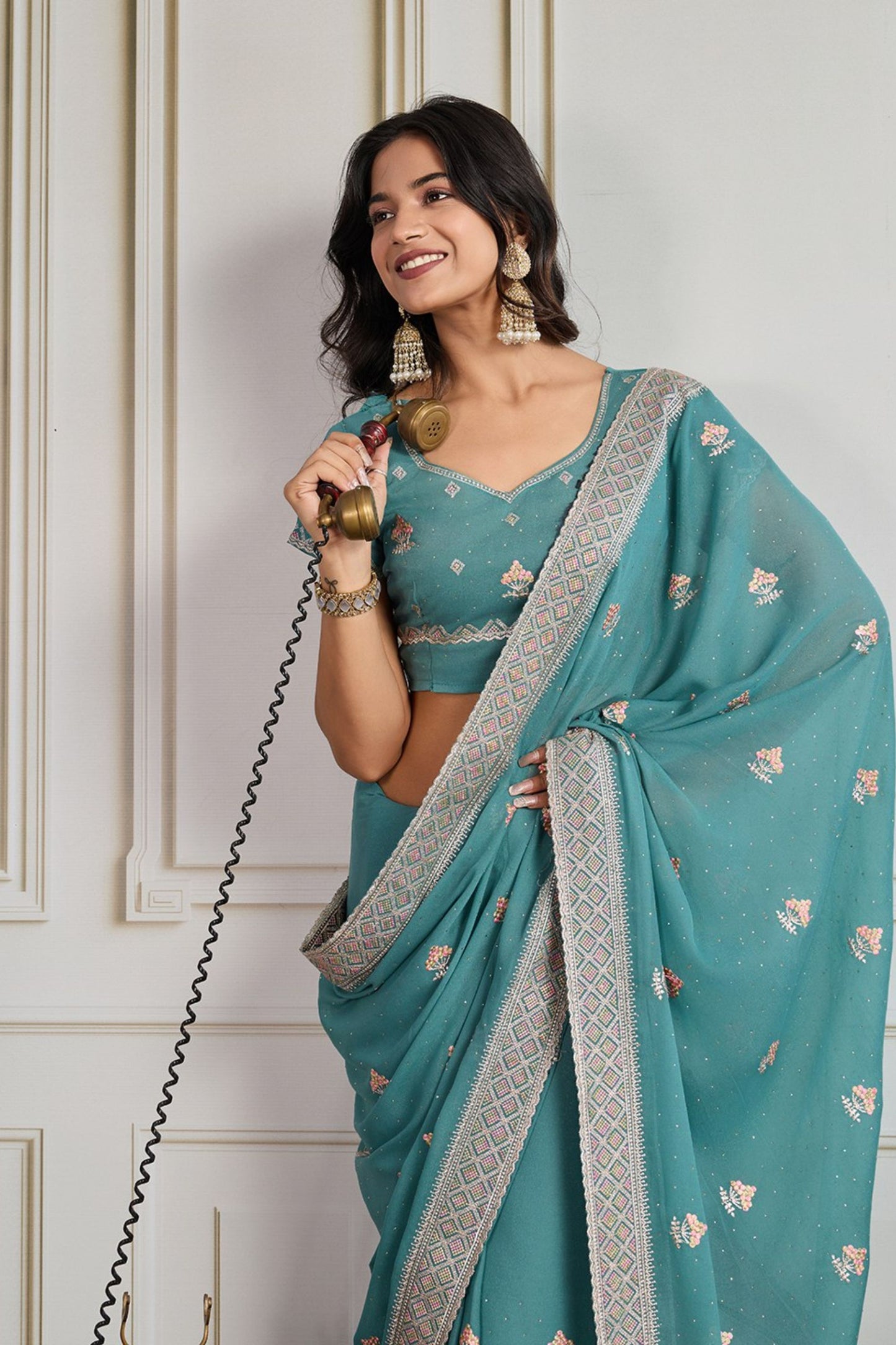 Teal Blue Georgette Saree with Embroidered Border Floral Motifs Party Wear