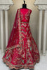 Luxurious Rani Pink Embroidered Silk Bridal Lehenga Choli with Net Dupatta