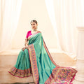 Turquoise Banarasi Silk Saree with Pink Zari Border Festive Wear