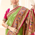 Elegant Green Banarasi Silk Saree with Pink Contrast Border