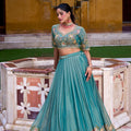 Elegant Teal Green Silk Embroidered Lehenga Choli with Floral Work and Matching Dupatta