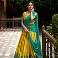 Unique Yellow Poly Cotton Lehenga Choli with Teal Green Zari Border and Embroidered Dupatta