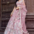 Elegant Dusty Pink Net Embroidered Wedding Lehenga Choli with Floral Sequins Work