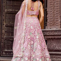 Elegant Dusty Pink Net Embroidered Wedding Lehenga Choli with Floral Sequins Work