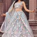 Stylish Turquoise Blue Net Embroidered Wedding Lehenga Choli with Floral Sequins Work