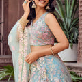 Stylish Turquoise Blue Net Embroidered Wedding Lehenga Choli with Floral Sequins Work
