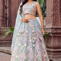 Stylish Turquoise Blue Net Embroidered Wedding Lehenga Choli with Floral Sequins Work