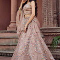 Gorgeous Beige Net Embroidered Wedding Lehenga Choli with Floral Sequins Work