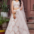Trendy Cream Net Embroidered Wedding Lehenga Choli with Floral Sequins Work