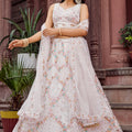 Trendy Cream Net Embroidered Wedding Lehenga Choli with Floral Sequins Work