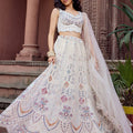 Trendy Cream Net Embroidered Wedding Lehenga Choli with Multicolor Thread and Sequins Work