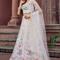 Trendy Cream Net Embroidered Wedding Lehenga Choli with Multicolor Thread and Sequins Work