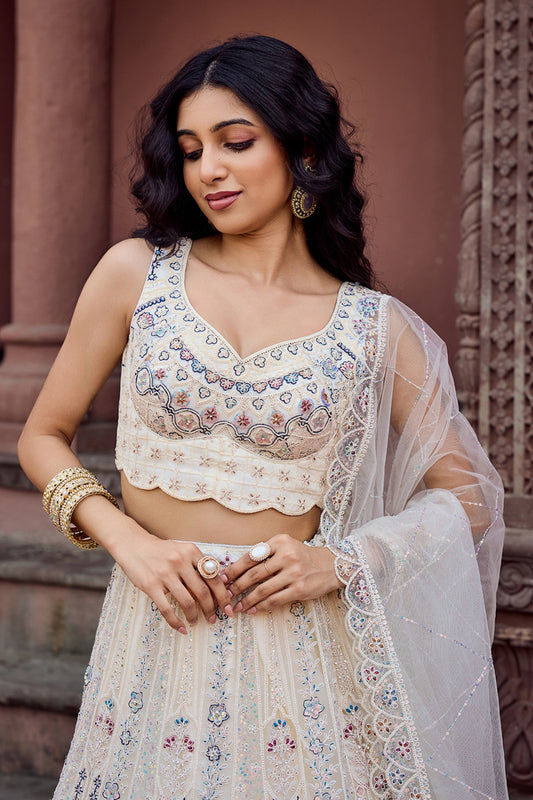Trendy Cream Net Embroidered Wedding Lehenga Choli with Multicolor Thread and Sequins Work