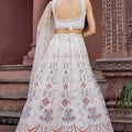Trendy Cream Net Embroidered Wedding Lehenga Choli with Multicolor Thread and Sequins Work
