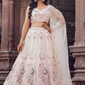 Fancy Cream Net Embroidered Wedding Lehenga Choli with Peacock Motif and Sequins Work