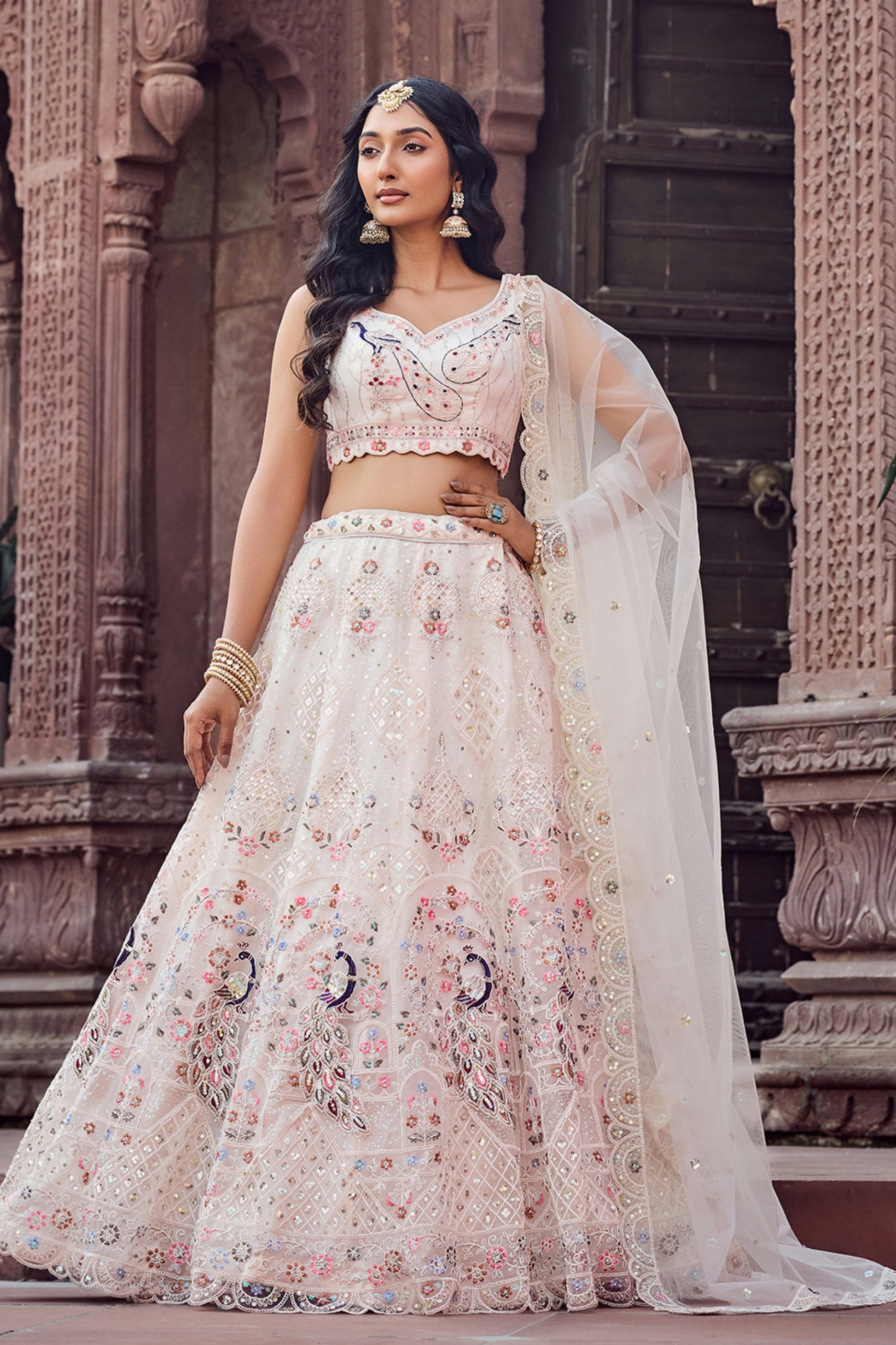 Fancy Cream Net Embroidered Wedding Lehenga Choli with Peacock Motif and Sequins Work