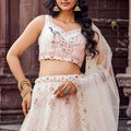 Fancy Cream Net Embroidered Wedding Lehenga Choli with Peacock Motif and Sequins Work