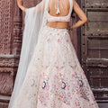 Fancy Cream Net Embroidered Wedding Lehenga Choli with Peacock Motif and Sequins Work