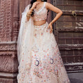 Fancy Cream Net Embroidered Wedding Lehenga Choli with Peacock Motif and Sequins Work
