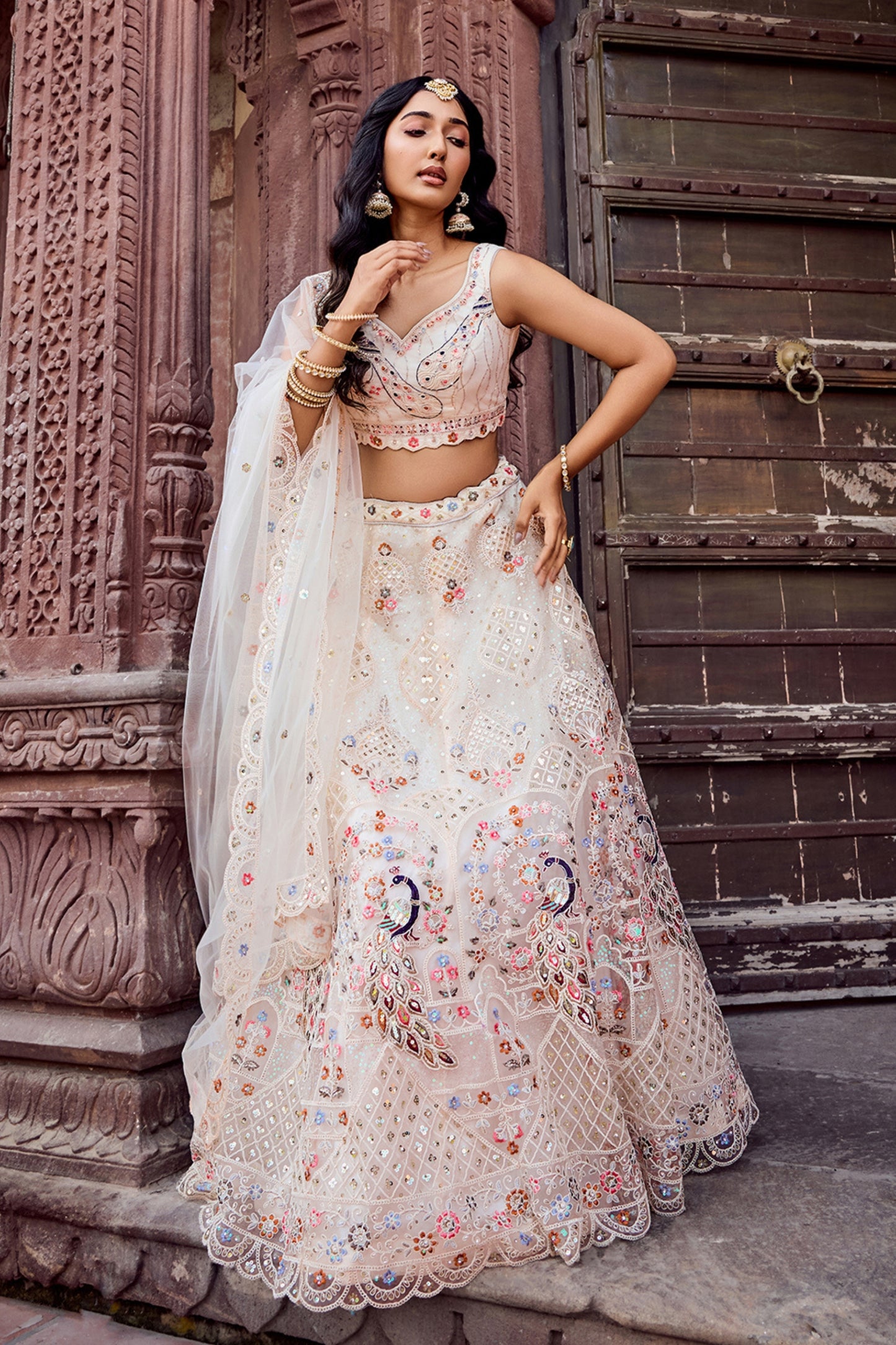 Fancy Cream Net Embroidered Wedding Lehenga Choli with Peacock Motif and Sequins Work