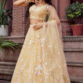 Radiant Yellow Net Embroidered Wedding Lehenga Choli with Floral Thread and Sequins Work