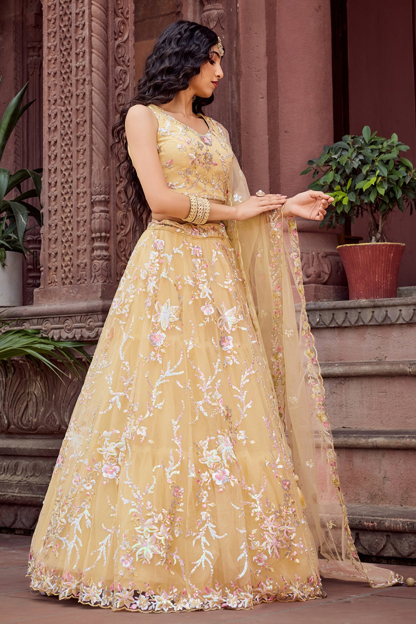 Radiant Yellow Net Embroidered Wedding Lehenga Choli with Floral Thread and Sequins Work