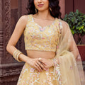 Radiant Yellow Net Embroidered Wedding Lehenga Choli with Floral Thread and Sequins Work