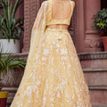 Radiant Yellow Net Embroidered Wedding Lehenga Choli with Floral Thread and Sequins Work
