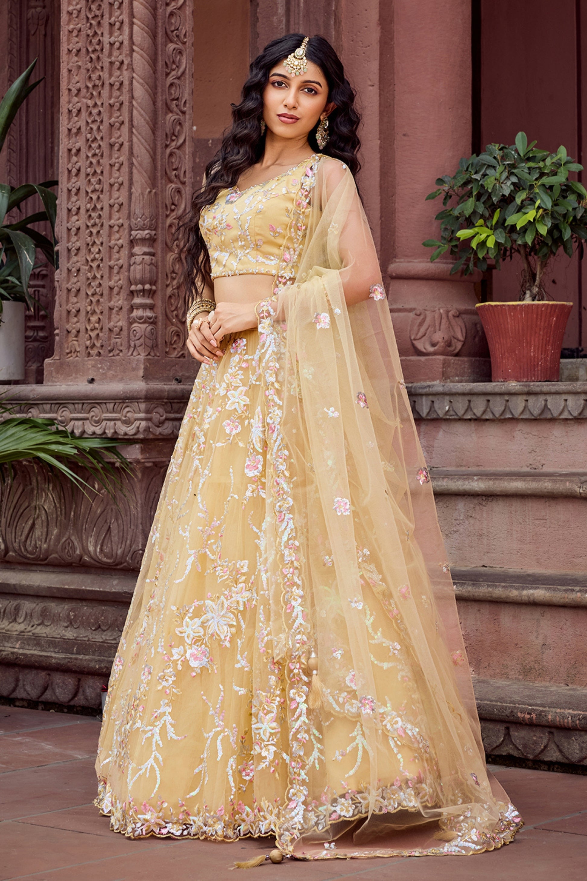 Radiant Yellow Net Embroidered Wedding Lehenga Choli with Floral Thread and Sequins Work