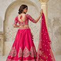 Vibrant Rani Pink Silk Embroidered Lehenga Choli with Matching Dupatta for Wedding