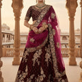 Royal Wine Velvet Embroidered Bridal Lehenga Choli with Heavy Zari Work and Net Dupatta